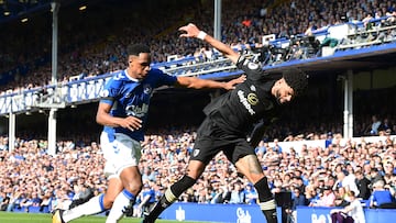 Everton's Colombian defender Yerry Mina (L) challenges Bournemouth's Danish midfielder Philip Billing during the English Premier League football match between Everton and Bournemouth at Goodison Park in Liverpool, northwest England, on May 28, 2023. (Photo by PETER POWELL / AFP) / RESTRICTED TO EDITORIAL USE. No use with unauthorized audio, video, data, fixture lists, club/league logos or 'live' services. Online in-match use limited to 120 images. An additional 40 images may be used in extra time. No video emulation. Social media in-match use limited to 120 images. An additional 40 images may be used in extra time. No use in betting publications, games or single club/league/player publications. / 