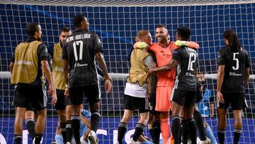 LISBON, PORTUGAL - AUGUST 15: Anthony Lopes of Olympique Lyon celebrates with his teammates following their team's victory in during the UEFA Champions League Quarter Final match between Manchester City and Lyon at Estadio Jose Alvalade on August 15,