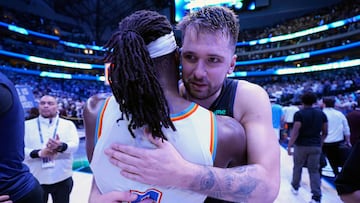 DALLAS, TEXAS - MAY 18: Luka Doncic #77 of the Dallas Mavericks hugs Luguentz Dort #5 of the Oklahoma City Thunder after Game Six of the Western Conference Second Round Playoffs at American Airlines Center on May 18, 2024 in Dallas, Texas. NOTE TO USER: User expressly acknowledges and agrees that, by downloading and or using this photograph, User is consenting to the terms and conditions of the Getty Images License Agreement. Sam Hodde/Getty Images/AFP (Photo by Sam Hodde / GETTY IMAGES NORTH AMERICA / Getty Images via AFP)