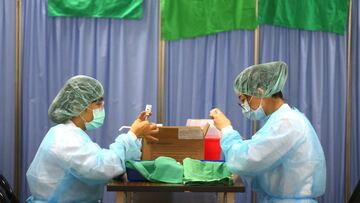 Nurses prepare doses of the AstraZeneca vaccine against the coronavirus disease (COVID-19) during a vaccination session for healthcare workers following the recent rise in COVID-19 infections in Taipei, Taiwan June 2, 2021. REUTERS/Ann Wang