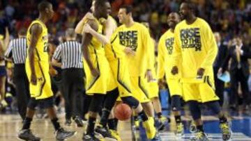 ALEGR&Iacute;A. Los jugadores de Michigan celebraron el triunfo.