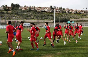 Players of the Hapoel Katamon Jerusalem team take part in a training session in Jerusalem on March 18, 2018.