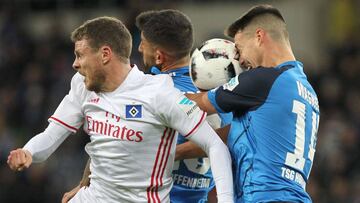 Hoffenheim's forward Sandro Wagner (R) and Hoffenheim's midfielder Nadiem Amiri vie for the ball with Hamburg's midfielder Nicolai Mueller during the German first division Bundesliga football match between TSG Hoffenheim and Hamburg SV in Sinsheim, southern Germany, on November 20, 2016. / AFP PHOTO / AMELIE QUERFURTH / RESTRICTIONS: DURING MATCH TIME: DFL RULES TO LIMIT THE ONLINE USAGE TO 15 PICTURES PER MATCH AND FORBID IMAGE SEQUENCES TO SIMULATE VIDEO. == RESTRICTED TO EDITORIAL USE == FOR FURTHER QUERIES PLEASE CONTACT DFL DIRECTLY AT + 49 69 650050