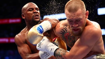 FILE PHOTO: Aug 26, 2017; Las Vegas, NV, USA; Floyd Mayweather Jr. lands a hit against Conor McGregor during their boxing match at the at T-Mobile Arena. Mandatory Credit: Mark J. Rebilas-USA TODAY Sports/File Photo