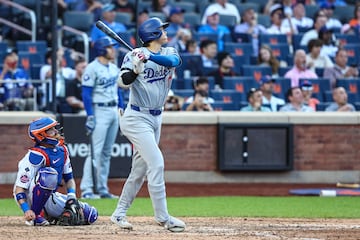 Los Angeles Dodgers designated hitter Shohei Ohtani (17) hits a two rum home run in the eighth inning.