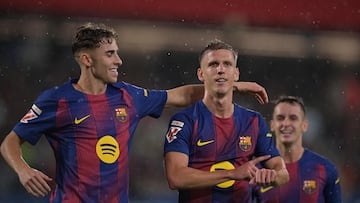 Barcelona's Spanish midfielder #20 Daniel Olmo celebrates scoring his team's third goal during the Spanish league football match between FC Barcelona and Getafe CF at Johan Cruyff Stadium in Barcelona on September 21, 2025. (Photo by MANAURE QUINTERO / AFP)