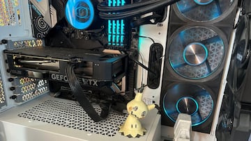 Close-up of an Nvidia GeForce RTX 4060 seated in a custom PC build, illuminated by RGB lighting.