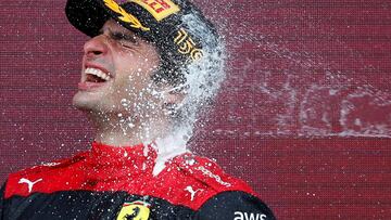 Formula One F1 - British Grand Prix - Silverstone Circuit, Silverstone, Britain - July 3, 2022 Ferrari's Carlos Sainz Jr. celebrates winning the race on the podium REUTERS/Andrew Boyers TPX IMAGES OF THE DAY