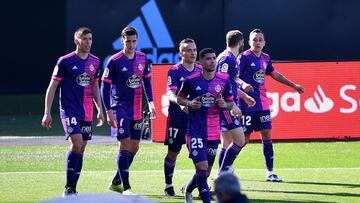 VIGO, SPAIN - FEBRUARY 28: Fabian Orellana (R) of Real Valladolid is congratulated by team mates (L - R) Ruben Alcaraz, Roque Mesa and Lucas Olaza after scoring their side's first goal during the La Liga Santander match between RC Celta and Real Vall