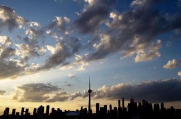 A silhouetted view of the skyline in Toronto, Ontario, on  July 10, 2015.    AFP PHOTO/ JIM WATSON