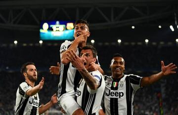 Paulo Dybala celebrates after scoring against Barcelona