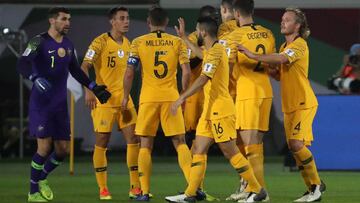 Australia&#039;s midfielder Chris Iknonomidis (3rd L) celebrates his goal with teammates during the 2019 AFC Asian Cup group B football match between Australia and Syria at the Khalifa bin Zayed stadium in al-Ain on January 15, 2019. (Photo by Karim Sahib