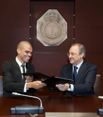 Pepe, along with club president Florentino Perez, when he signed his current deal with the club back in 2015