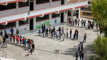 People queue to vote at the Cesar Arroyo school, located in a rural and peasant area, during the presidential elections, in Cayambe, Ecuador August 20, 2023. REUTERS/Karen Toro