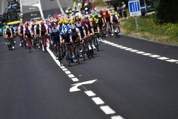 The pack rides during the twelfth stage of the 106th edition of the Tour de France cycling race between Toulouse and Bagneres-de-Bigorre, on July 18, 2019. (Photo by JEFF PACHOUD / AFP)