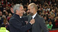 Manager Jose Mourinho of Manchester United shares a joke with Manager Pep Guardiola of Manchester City 