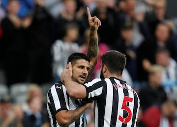 Newcastle United’s Aleksandar Mitrovic celebrates scoring their first goal with Grant Hanley