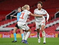 Bayern Munich's Japanese midfielder #18 Momoko Tanikawa (R) celebrates with Bayern Munich's Danish forward #21 Pernille Harder (C) after scoring Bayern Munich's third goal during the UEFA Women's Champions League, Quarter Final first-leg football match between Manchester United and Bayern Munich at Old Trafford in Manchester, north west England, on March 25, 2025. (Photo by Paul ELLIS / AFP)