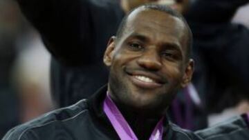 United States' LeBron James celebrates after winning the gold medal at the men's basketball game against Spain at the 2012 Summer Olympics, Sunday, Aug. 12, 2012, in London. (AP Photo/Charles Krupa)