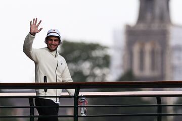 Alcaraz waves at Wimbledon after winning the men's singles title.