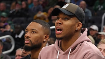 Damian Lillard #0 and Giannis Antetokounmpo #34 of the Milwaukee Bucks