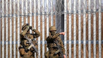 Members of the Polish Border Guard stands by the reinforced barrier at the Polish-Belarusian border, on the day of a visit by Polish Prime Minister Donald Tusk, in Ozierany Male, Poland, March 22, 2025. Agnieszka Sadowska/Agencja Wyborcza.pl via REUTERS ATTENTION EDITORS - THIS IMAGE WAS PROVIDED BY A THIRD PARTY. POLAND OUT. NO COMMERCIAL OR EDITORIAL SALES IN POLAND.
