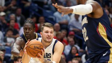 Oct 25, 2019; New Orleans, LA, USA; Dallas Mavericks forward Luka Doncic (77) drives past New Orleans Pelicans guard Jrue Holiday (11) in the second half at the Smoothie King Center. Mandatory Credit: Chuck Cook-USA TODAY Sports