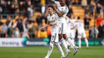 WOLVERHAMPTON, ENGLAND - MARCH 18: Junior Firpo of Leeds United celebrates with teammate Rodrigo Moreno following victory in the Premier League match between Wolverhampton Wanderers and Leeds United at Molineux on March 18, 2023 in Wolverhampton, England. (Photo by Naomi Baker/Getty Images)