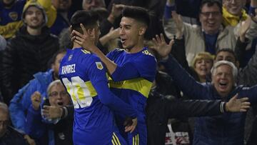 Boca Juniors' midfielder Juan Ramirez (L) celebrates with teammate Guillermo Fernandez after scoring the team's second goal against Defensa y Justicia during their Argentine Professional Football League quarterfinal match at La Bombonera stadium in Buenos Aires, on May 10, 2022. (Photo by Juan MABROMATA / AFP)