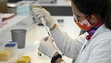 A scientist works at the mAbxience biosimilar monoclonal antibody laboratory plant in Garin, Buenos Aires province, on August 14, 2020, where an experimental coronavirus vaccine will be produced for Latin America. - Argentina will manufacture while Mexico will pack and distribute in Latin America, except of Brazil, the vaccine against COVID-19 developed by the University of Oxford and the AstraZeneca laboratory. (Photo by JUAN MABROMATA / AFP)