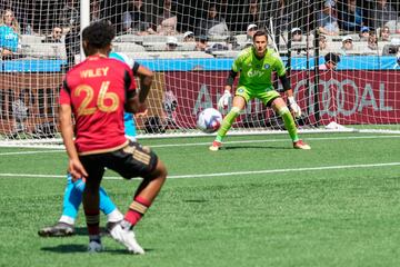 Caleb Wiley shoots on goal against Charlotte FC goalkeeper Pablo Sisniega.