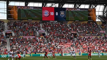 A general view shows players competing as the scoreboard is seen in the background during the Club World Cup 2025 Group C football match between Germany's Bayern Munich and New Zealand's Auckland City at the TQL stadium in Cincinnati on June 15, 2025. (Photo by Paul ELLIS / AFP)