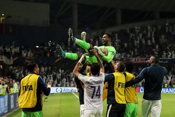 AL AIN, UNITED ARAB EMIRATES - DECEMBER 18: Khalid Eisa of AI Ain FC celebrates with his team mates after saving the winning penalty during the FIFA Club World Cup UAE 2018 Semi Final match between River Plate and Al Ain at Hazza Bin Zayed Stadium on December 18, 2018 in Al Ain, United Arab Emirates. (Photo by Matthew Ashton - AMA/Getty Images)