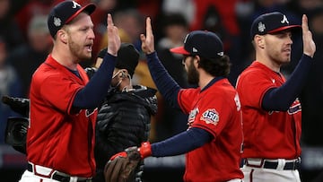 ATLANTA, GEORGIA - OCTOBER 29: Will Smith #51 of the Atlanta Braves celebrates with Dansby Swanson #7 after closing out the 2-0 win against the Houston Astros in Game Three of the World Series at Truist Park on October 29, 2021 in Atlanta, Georgia.   Elsa