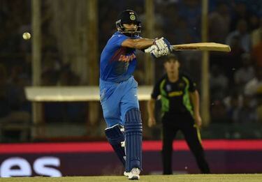 Kohli dazzles to propel India into World T20 semis