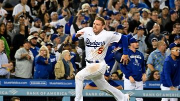 Apr 18, 2022; Los Angeles, California, USA; Los Angeles Dodgers first baseman Freddie Freeman (5) scores in the fourth inning against the Atlanta Braves at Dodger Stadium. Mandatory Credit: Richard Mackson-USA TODAY Sports