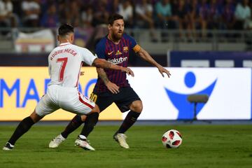 Messi y Roque Mesa.