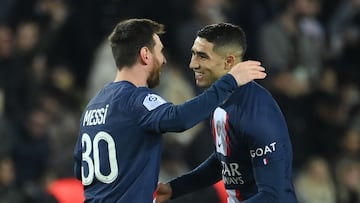 Paris Saint-Germain's Argentine forward Lionel Messi (L) celebrates with Paris Saint-Germain's Moroccan defender Achraf Hakimi after scoring his team's second goal during the French L1 football match between Paris Saint-Germain (PSG) and Toulouse FC at the Parc des Princes stadium in Paris on February 4, 2023. (Photo by FRANCK FIFE / AFP)