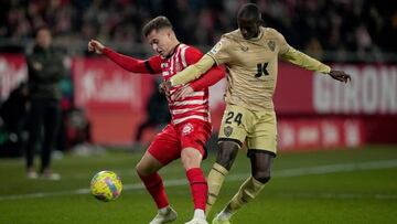 GIRONA, SPAIN - FEBRUARY 17: Rodrigo Riquelme of Girona FC competes for the ball with Houboulang Mendes of UD Almeria  during the LaLiga Santander match between Girona FC and UD Almeria at Montilivi Stadium on February 17, 2023 in Girona, Spain. (Photo by Alex Caparros/Getty Images)