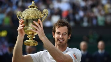 Britain's Andy Murray posing with the winner's trophy after his men's singles final victory over Canada's Milos Raonic on the last day of the 2016 Wimbledon Championships