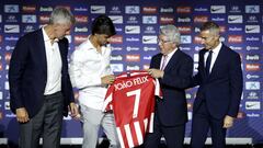 Joao Félix receives his number 7 shirt from Atlético president Enrique Cerezo and executives Miguel Ángel Gil Marín and Andrea Berta.