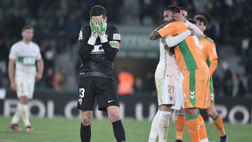 Elche's Spanish goalkeeper Edgar Badia (L) reacts at the end of the Spanish League football match between Elche CF and Real Betis at the Martinez Valero stadium in Elche, on February 24, 2023. (Photo by Jose Jordan / AFP)