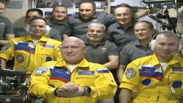 In this frame grab from video provided by Roscosmos, Russian cosmonauts Sergey Korsakov, Oleg Artemyev and Denis Matveyev are seen during a welcome ceremony after arriving at the International Space Station, Friday, March 18, 2022, the first new faces in 