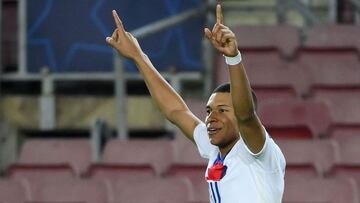 Paris Saint-Germain's French forward Kylian Mbappe celebrates after scoring his team's fourth goal during the UEFA Champions League round of 16 first leg football match between FC Barcelona and Paris Saint-Germain FC at the Camp Nou stadium in B