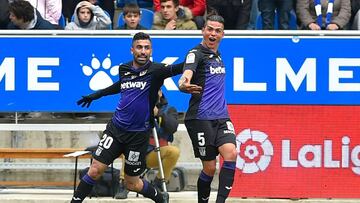 Leganes' Argentinian defender Jonathan Silva (R) celebrates with Leganes' Uruguayan forward Michael Santos after scoring
during the Spanish league football match between Deportivo Alaves and CD Leganes at the Mendizorroza stadium in Vitoria on
