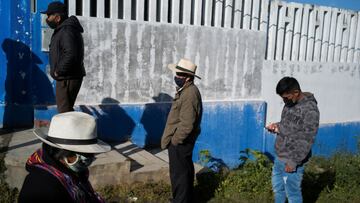 People stand outside a polling station to cast their votes in the presidential and parliamentary elections, in Canta, Peru April 11, 2021. REUTERS/Alessandro Cinque