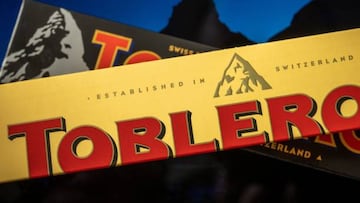 A picture taken on March 6, 2023, shows packagings of Toblerone chocolate bars owned by US firm Mondelez with a representation of the Matterhorn mountain (back) and of a generic mountain (front) in Geneva. - Toblerone is to remove the Swiss iconic Matterhorn peak from its packaging when some of the chocolate's production is moved from Switzerland to Slovakia and replaced by a more generic mountain under strict "Swissness" rules. (Photo by Fabrice COFFRINI / AFP) (Photo by FABRICE COFFRINI/AFP via Getty Images)