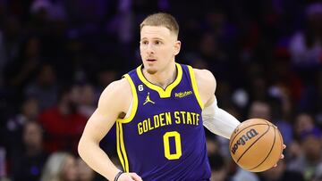 PHILADELPHIA, PENNSYLVANIA - DECEMBER 16: Donte DiVincenzo #0 of the Golden State Warriors dribbkes during the third quarter against the Philadelphia 76ers at Wells Fargo Center on December 16, 2022 in Philadelphia, Pennsylvania. NOTE TO USER: User expressly acknowledges and agrees that, by downloading and or using this photograph, User is consenting to the terms and conditions of the Getty Images License Agreement. (Photo by Tim Nwachukwu/Getty Images)