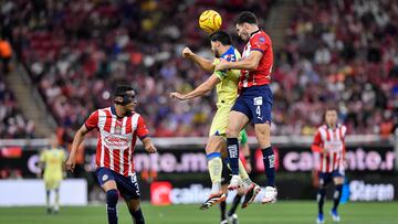    Henry Martin (L) of America jumps for the ball with Antonio Briseño (R) of Guadalajara during the 12th round match between Guadalajara and America as part of the Torneo Clausura 2024 Liga BBVA MX at Akron Stadium on March 16, 2024 in Guadalajara, Jalisco, Mexico.