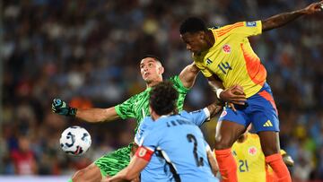 Uruguay's goalkeeper #01 Sergio Rochet and Colombia's forward #14 Jhon Durán fight for the ball during the 2026 FIFA World Cup South American qualifiers football match between Uruguay and Colombia at the Centenario stadium in Montevideo on November 15, 2024. (Photo by DANTE FERNANDEZ / AFP) (Photo by DANTE FERNANDEZ/AFP via Getty Images)